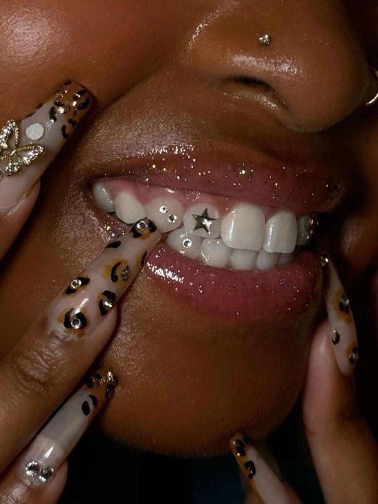 Tooth gems with star charm and leopard print nails