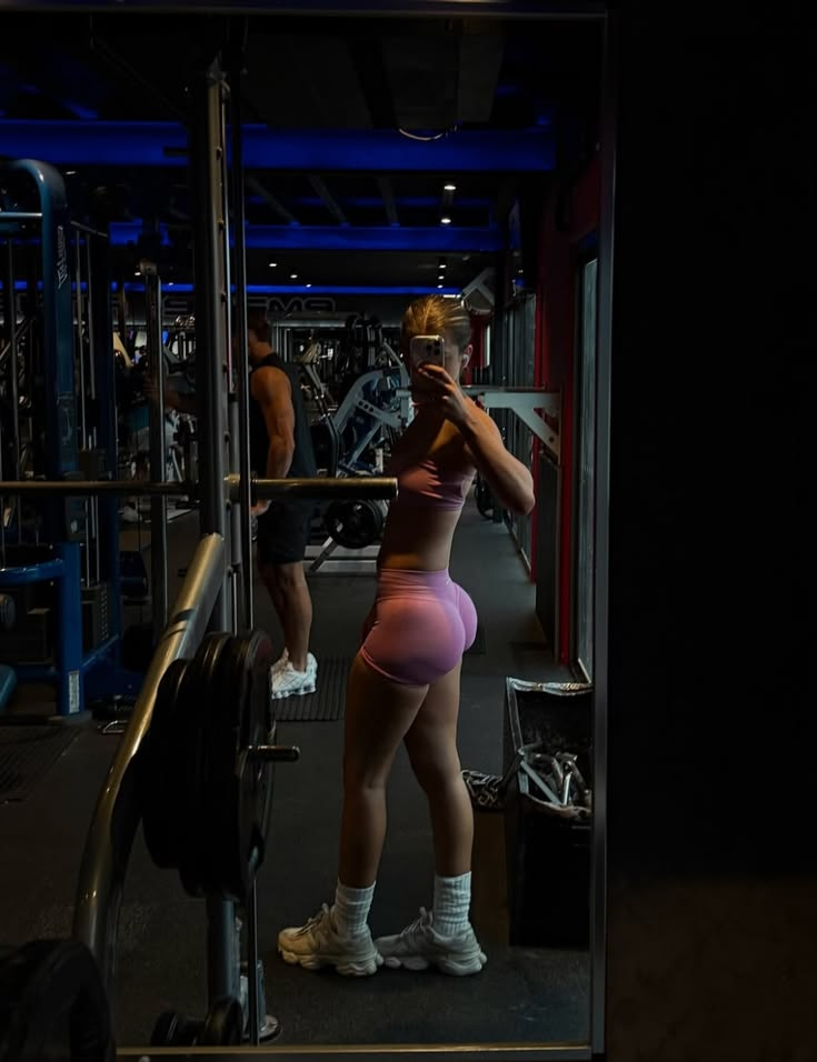 Gym workout lifestyle image with a person in pink activewear