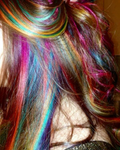 Rainbow colored hair clip-in streaks in dark hair