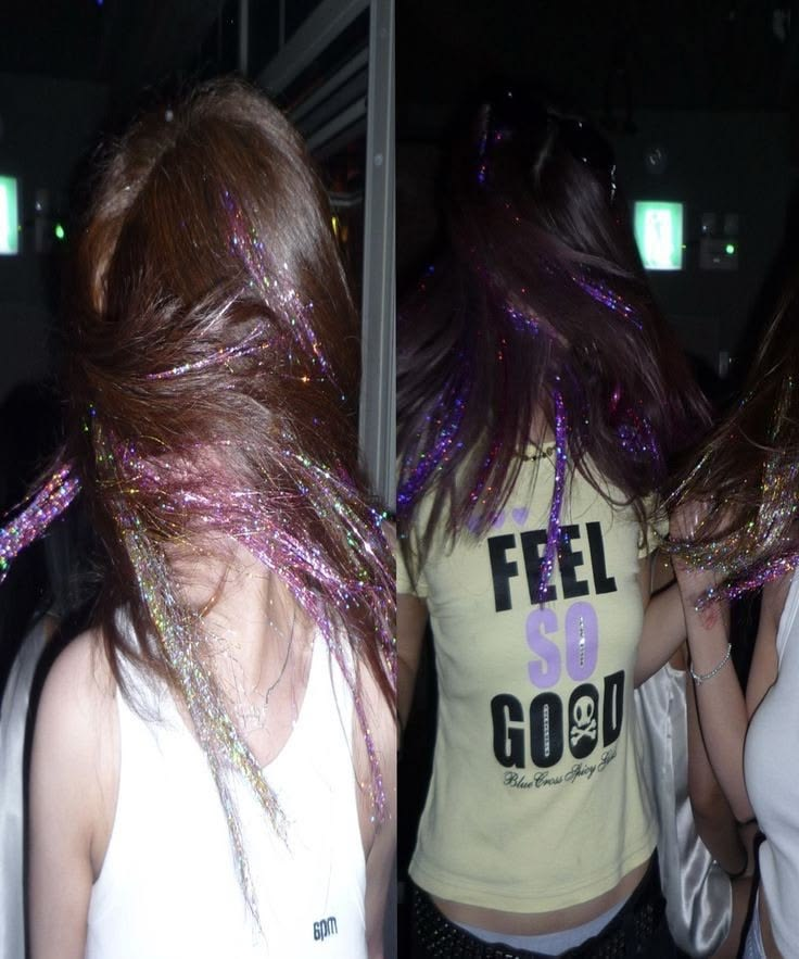 Shimmering purple and silver tinsel styled in brown hair