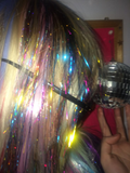 Colorful reflective tinsel strands styled in hair